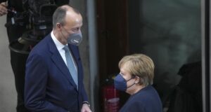 Лидерът на ХДС Фридрих Мерц и бишвата канцлерка Ангела Меркел