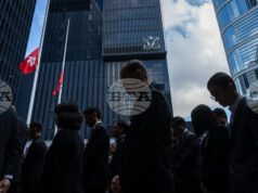 Хонконг скърби за жертвите на пожара, отнел по последни данни живота на 128 души